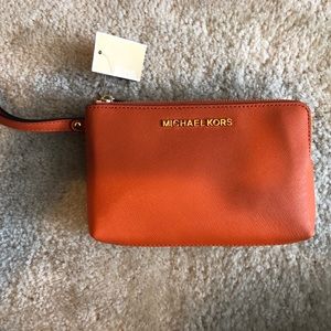 Micheal Kors Wristlet -- Brown & Tangerine colored